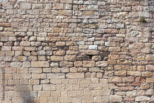 Antique street wall from bricks in Italy
