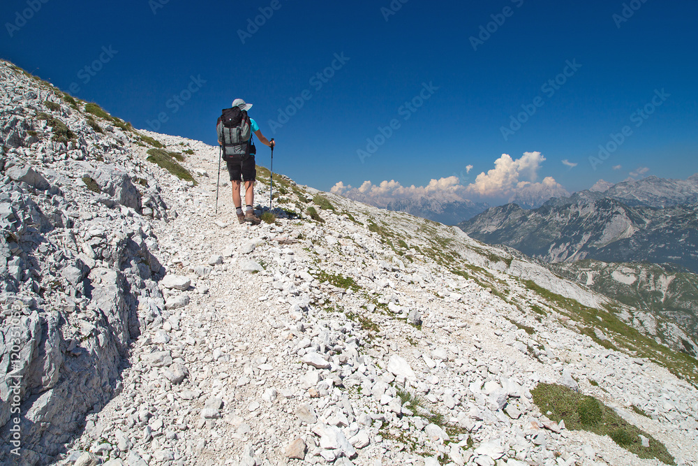 Mountaineer on the march to the mountain Peski, Mountain Krn, Julian Alps, Slovenia