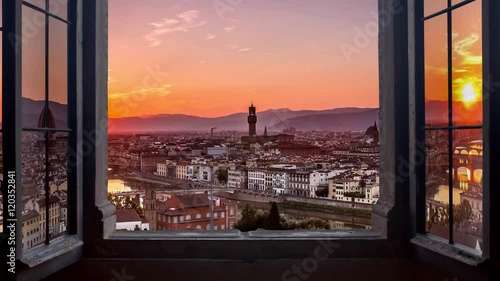 florence skyline seen from an open window aerial day to night timelapse at the sunset to night city lighting up  panorama from piazzale michelangelo 4k photo