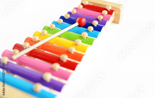 Colorful baby xylophone with stick isolated over white background