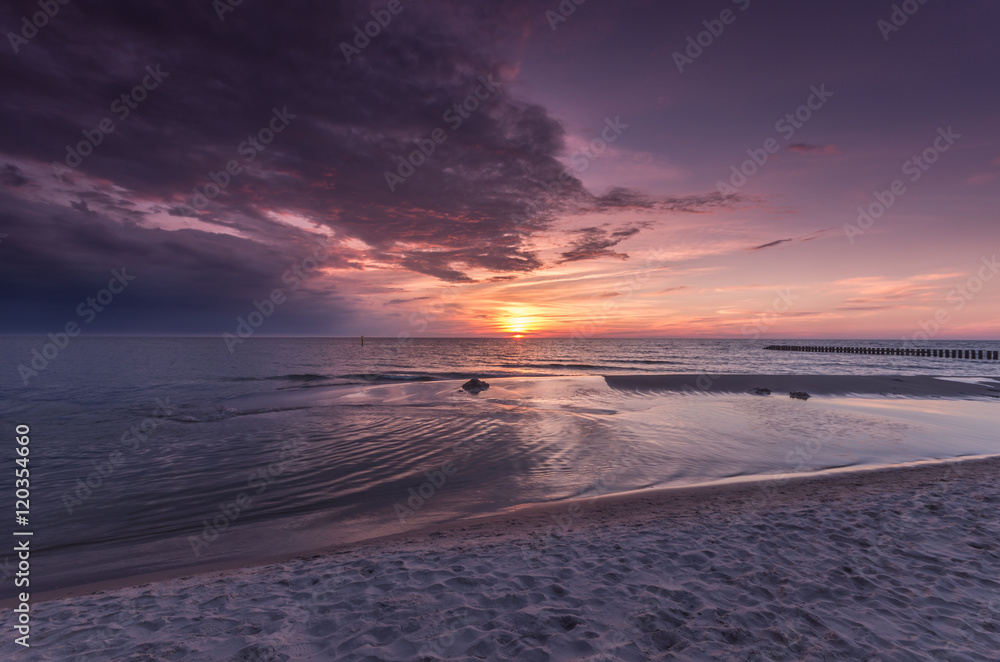 Baltic sea beach on colorful sunset, Poland