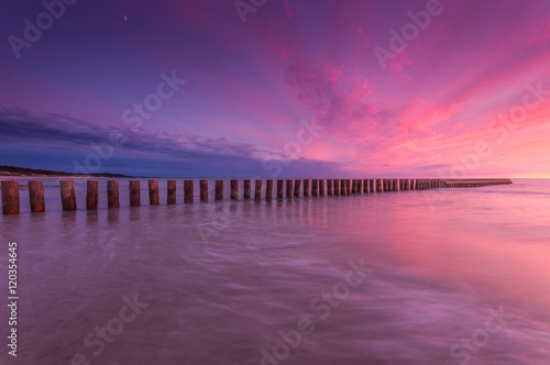 Wooden breakwater - Baltic seascape at sunset  Poland