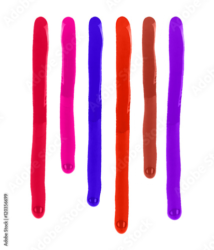colored drips paint or nail polish on white background