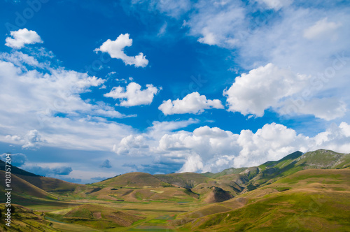 Gentle Hills under blue sky with clouds