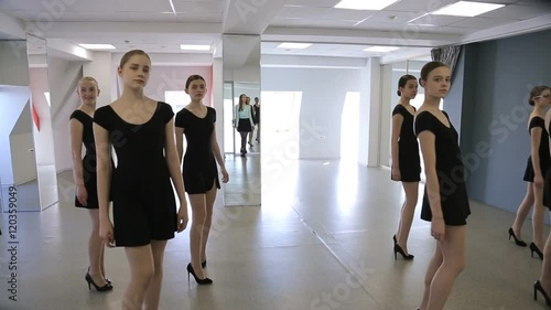 Young models make rehearsal of defile in classroom photo
