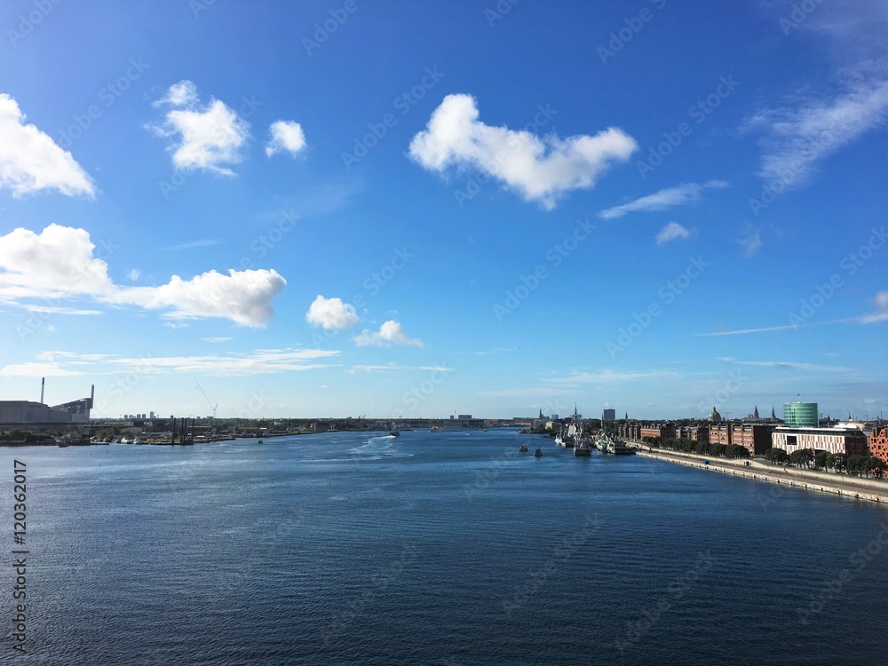 Copenhagen, the capital of Denmark. The picture is taken in Nordhavn, in the north-eastern part of the city. This is the Channel between the Amager island to the left, and the Copenhagen, the capital of Denmark. The picture is taken in Nordhavn, in the north-eastern part of the city. This is the Channel between the Amager island to the left, and the