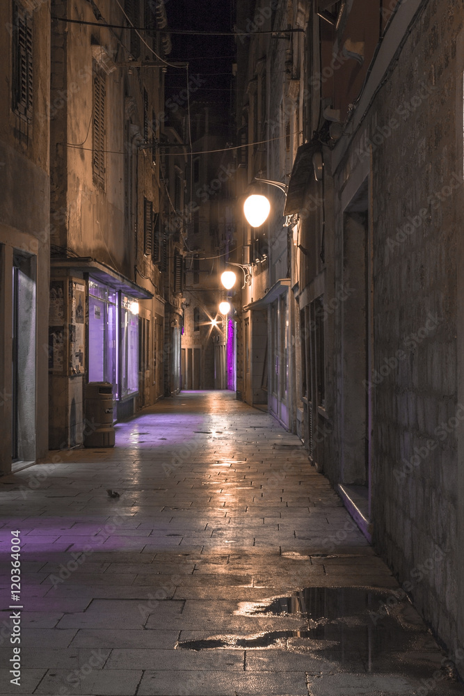 Empty alley in old town Sibenik at night