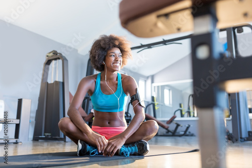 Sporty young African American woman working out