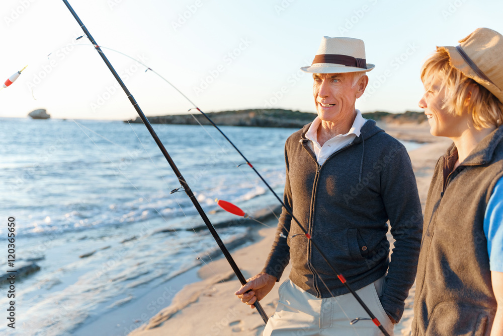 Senior man fishing with his grandson Senior man fishing with his grandson