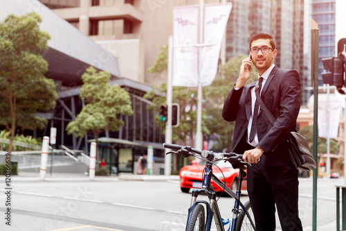 Young businessmen with a bike © Sergey Nivens