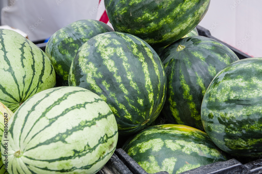Watermelon on display in bulk at the market Watermelon on display in bulk at the market