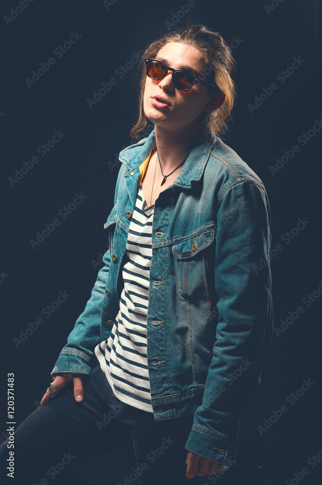 Rock and roll man. Guy in a rocker clothes. Rock style. Casual style. Toned  image. Stock Photo | Adobe Stock