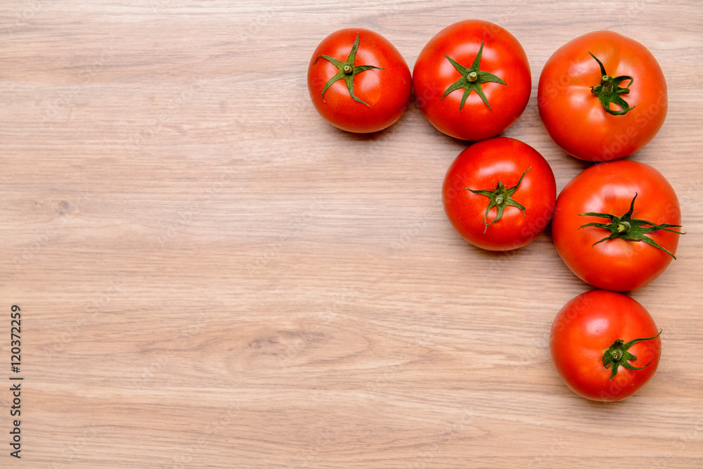 red tomatoes on wooden ground red tomatoes on wooden ground