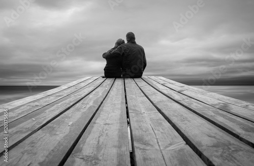 couple hugging on the bridge to eternity