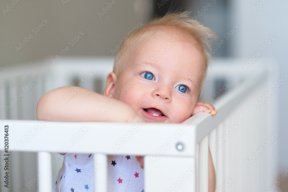 Baby boy standing in crib Baby boy standing in crib