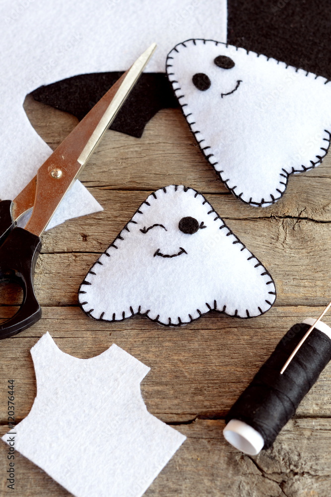 Cute white ghosts crafts, felt sheets, scissors, thread, needles