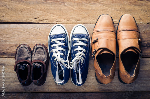 Three pairs of shoes, three stages of the growth.