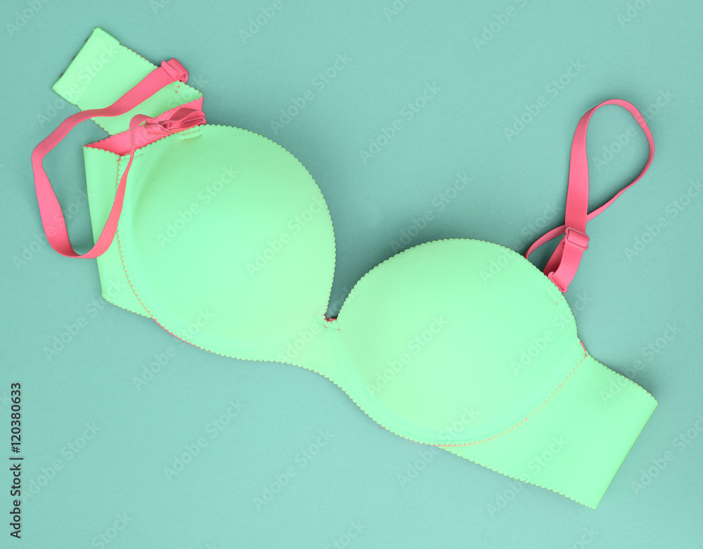 Summer concept, Blue bra on blue background. (Pop art style) Summer concept, Blue bra on blue background. (Pop art style)