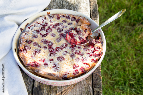 Cherry clafoutis. Homemade cherry pie on rustic background