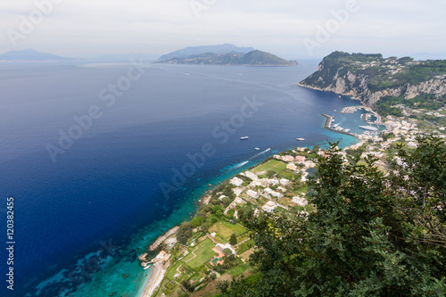 Panoramic view with sea and coastal buildings. Typical summer da