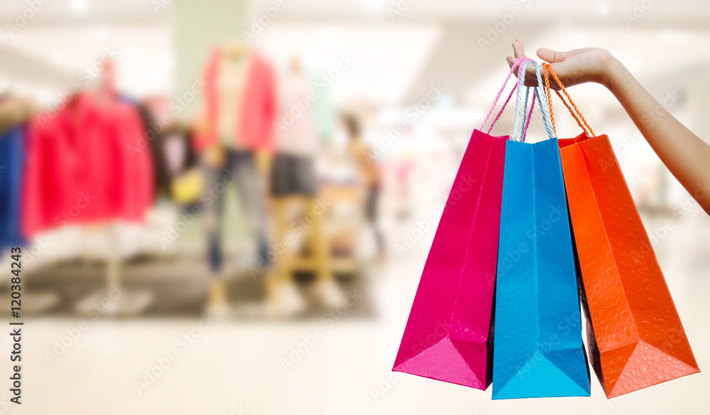 Woman with shopping bags in shopping mall Woman with shopping bags in shopping mall