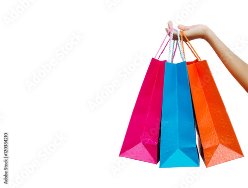Hand hold shopping bags, white background.
