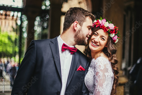 Groom and bride near the columns