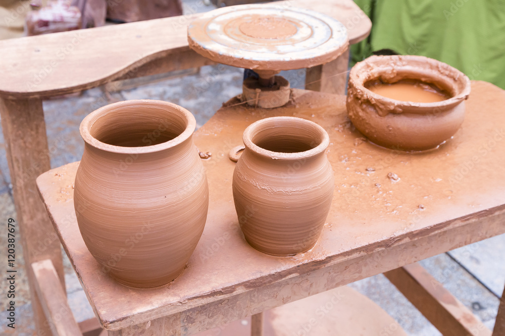 two freshly made clay vasestwo freshly made clay vases on the worktable of a potter
