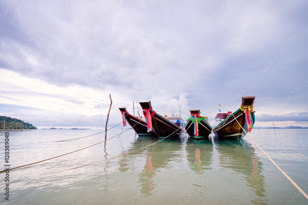 Traveling Thailand. Beautiful landscape with traditional long tail boats near the sea coast.