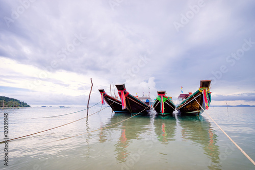 Fototapeta Naklejka Na Ścianę i Meble -  Traveling Thailand. Beautiful landscape with traditional long tail boats near the sea coast.