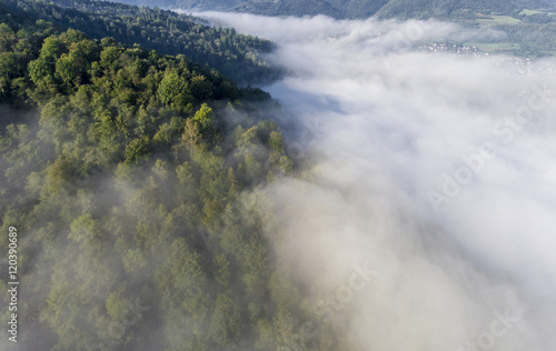 Landscape misty panorama. Fantastic dreamy sunrise on rocky moun