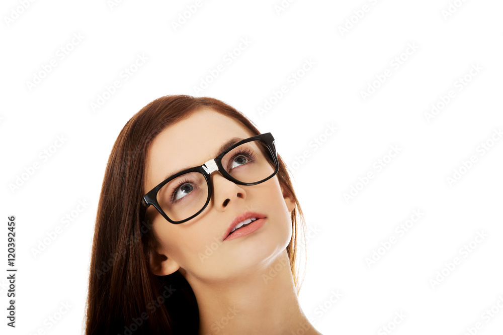 Young beautiful woman thinking looking up Young beautiful woman thinking looking up