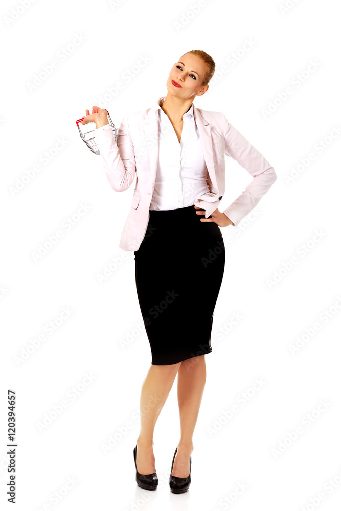 Smile business woman holding small shopping basket Smile business woman holding small shopping basket