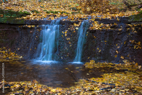 Fototapeta Naklejka Na Ścianę i Meble -  Beautiful landscape with a waterfall in the autumn forest (harmo