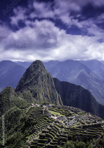 Vertical picture of the lost Inca city of Machu Picchu ruins.