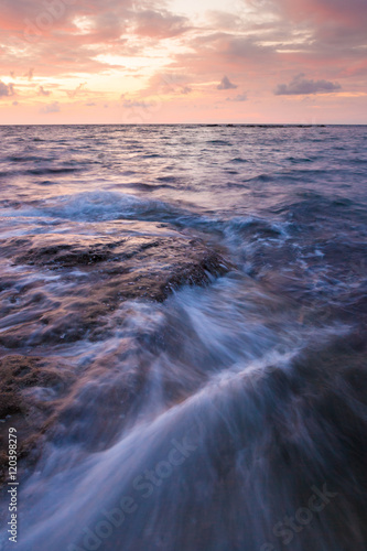 Long exposure sea and rocks at twilight