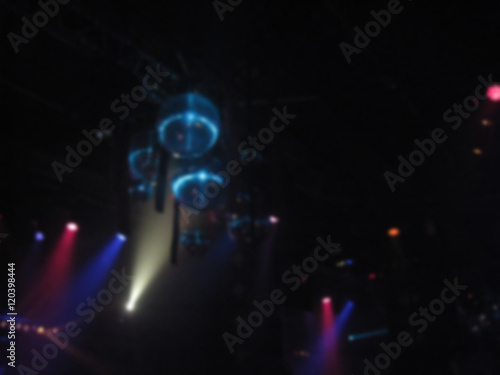 Disco party spotlights  disco ball and stage background. Blurry effect