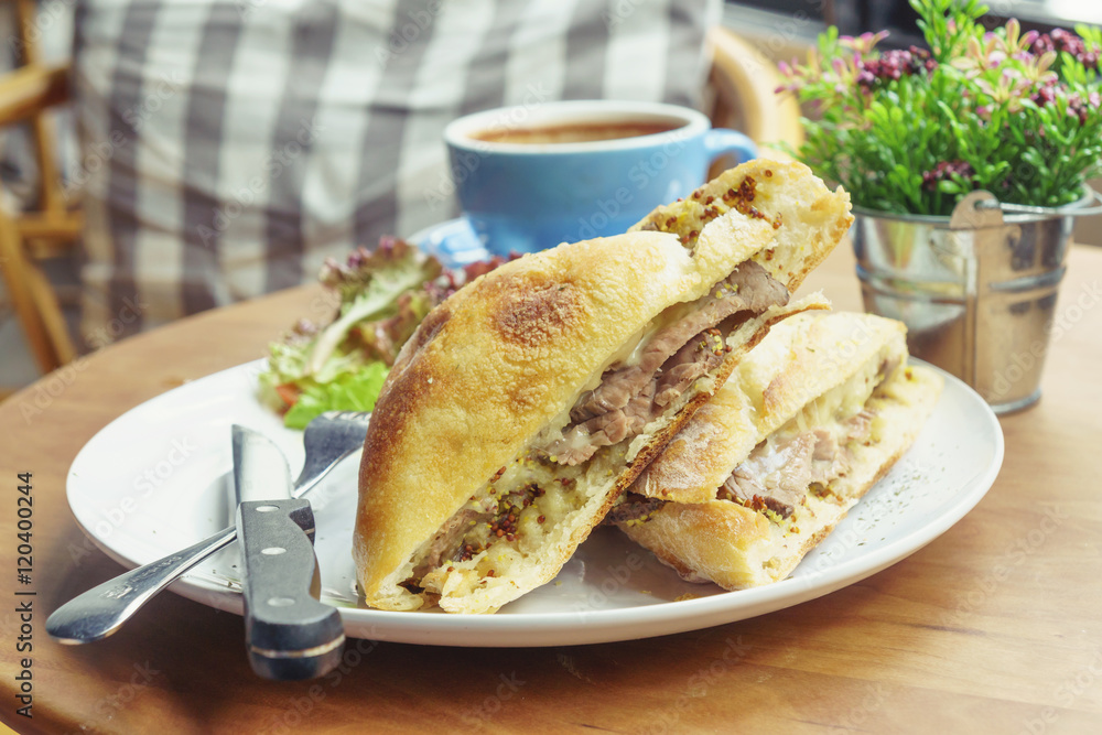 Roast beef sandwich with cheese and mustard sauce Roast beef sandwich with cheese and mustard sauce