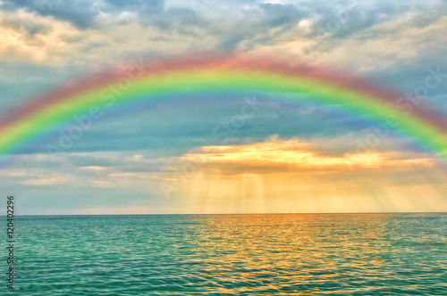 Marine sunset with a rainbow