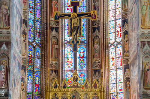 Jesus Christ on the cross, crucifix with stained glass windows 