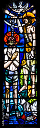 The baptism of Jesus on Jordan, by John the Baptist. Modern church stained glass window