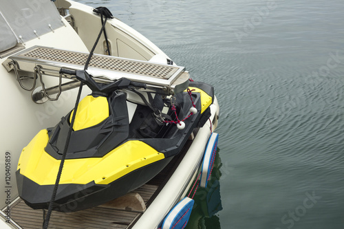 Jet ski placed on a boat at the sea