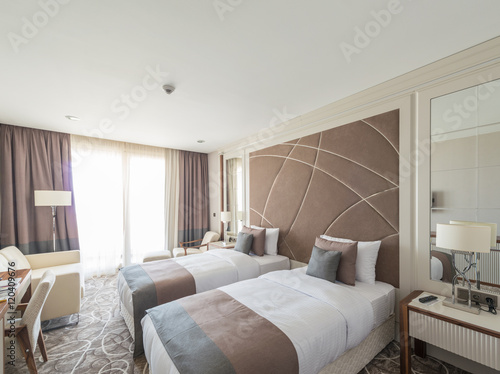 Modern hotel room with big bed