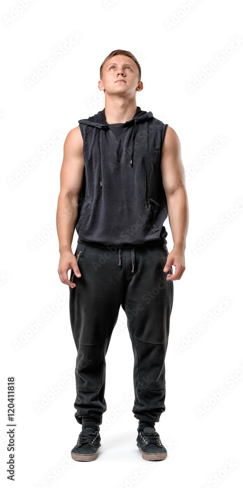 Full body portrait of handsome muscled young man looking up, isolated on white background Full body portrait of handsome muscled young man looking up, isolated on white background