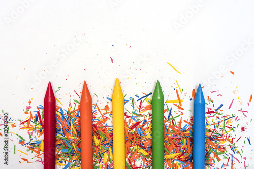 Wax paints in bright colors on white isolated background with copy space photo