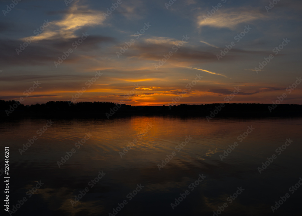 Majestic red sunset and its reflection in river Majestic red sunset and its reflection in river