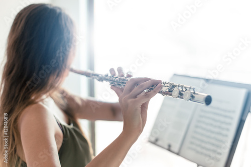 Tela Playing the flute