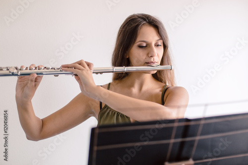 Flutist musician playing 