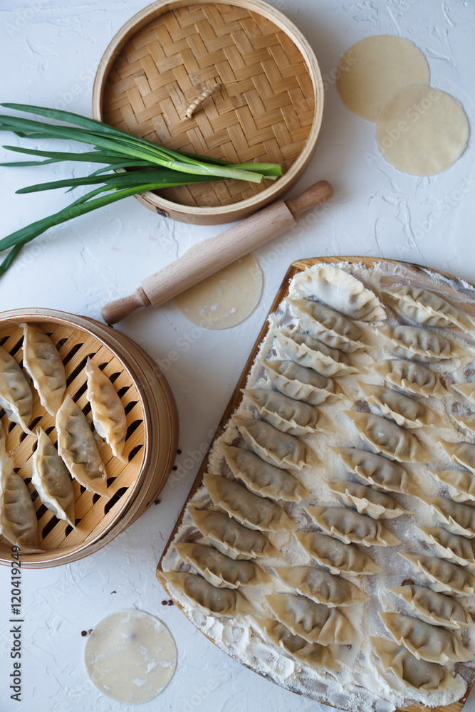 raw dumplings on the wooden desk raw dumplings on the wooden desk