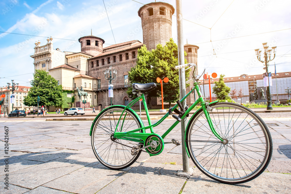 Green bicycle near Madama castle in the old city center of Turin in Piedmont region in Italy